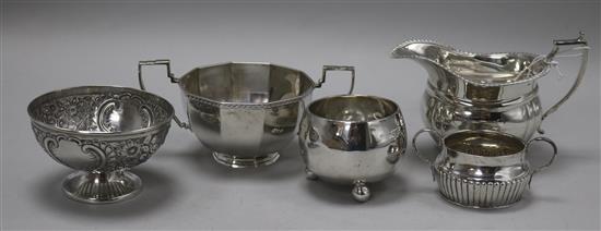 A Victorian silver sugar bowl, Edward Hutton, London, 1883, three other sugar bowls and a cream jug.